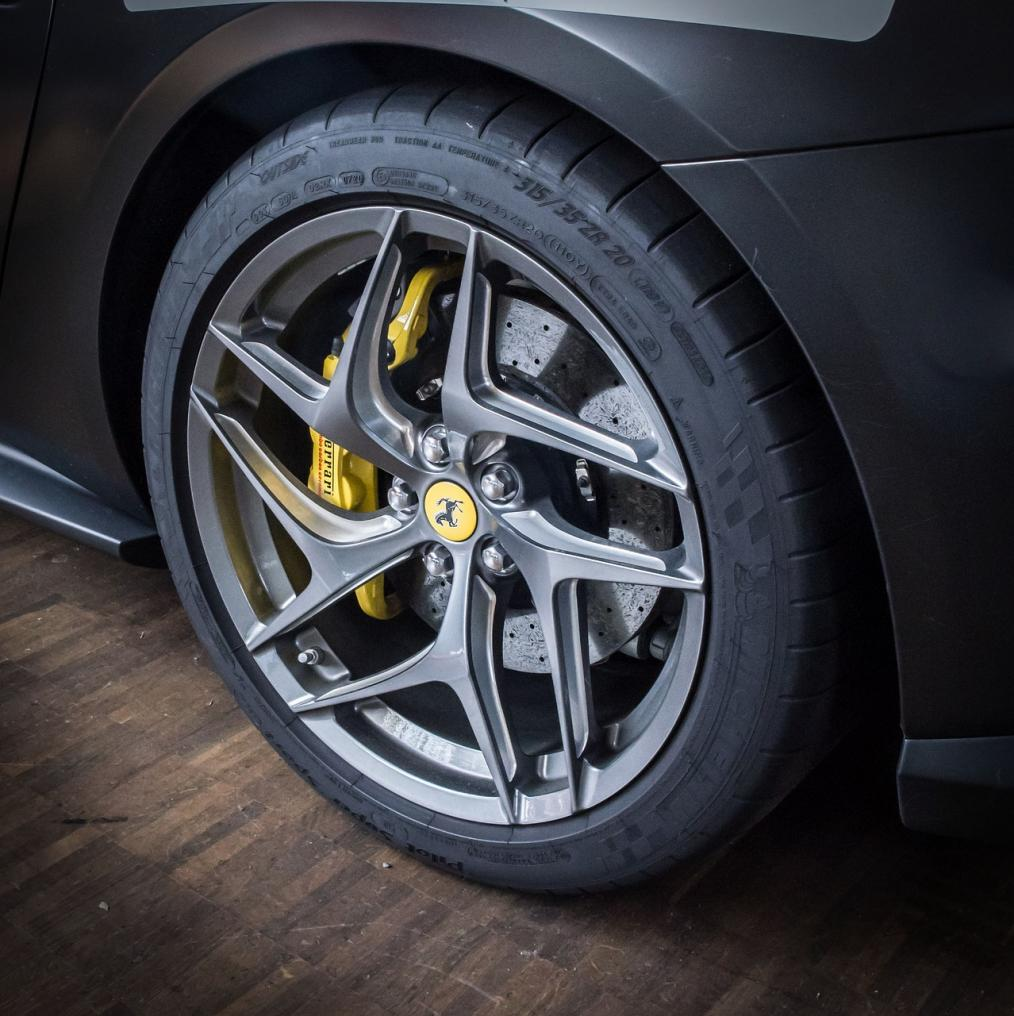 A forged wheel is a type of automotive wheel crafted through a process that involves shaping a single piece of aluminum or another alloy under high pressure.